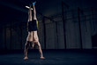 © baranq - Bodyweight training, man standing on hands