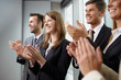 © baranq - Group of business people clapping hands. Business seminar concep