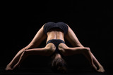 Fototapeta  - Standing Straddle Forward Bend yoga pose