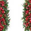Christmas Decorative Border. Christmas background border with red bauble decorations, holly, mistletoe, ivy, fir, pine cones and traditional winter greenery over white.