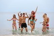 © Africa Studio - Beautiful young people having fun on beach
