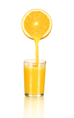 Sticker - orange juice pouring in glass from half of orange isolated on wh