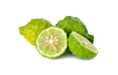 whole and half cut fresh bergamot or Leech Lime on white backgro