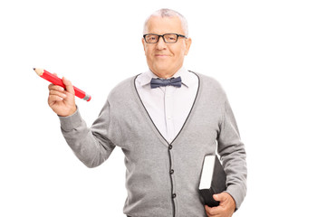 Poster - Mature school teacher holding a big red pencil