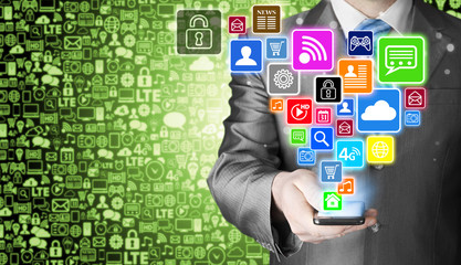 Business man using smart phone with social media icon set