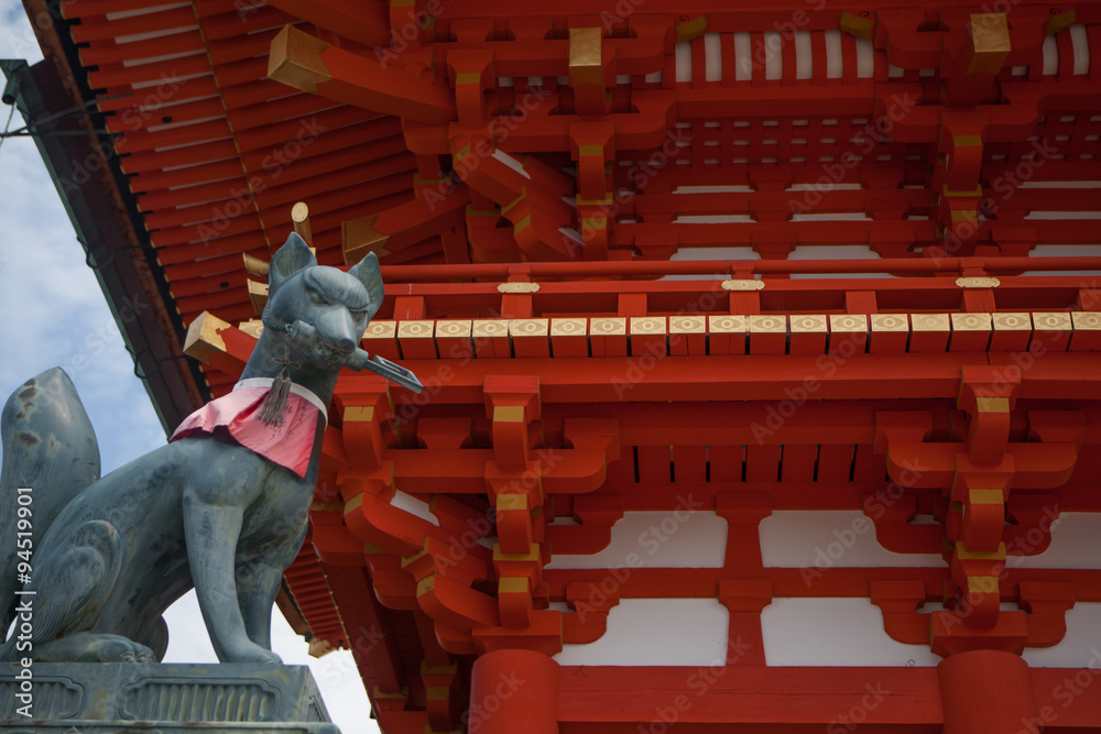 Statue of the fox-like deity Inari near the main hall of the Shinto ...