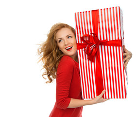 Happy young woman hold red Christmas wrapped gift present smilin