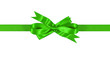 Bright green gift ribbon bow straight horizontal banner isolated on white background for christmas or birthday present decoration photo
