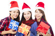 © Tom Wang - happy young woman group in santa hat with giftbox