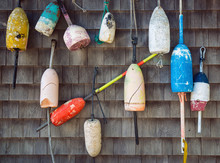 Old Lobster Buoys Hanging On The Wall