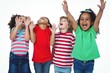 Four kids standing with arms raised in the air