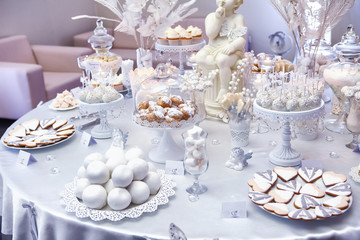 Dessert table with cake and candy on a wedding day