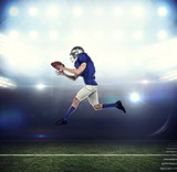 Fototapeta Sport - American football player running while catching ball
