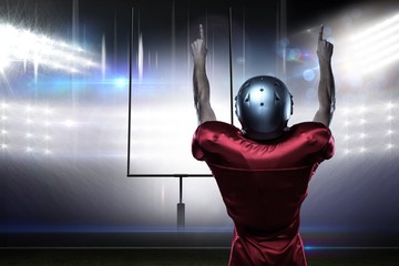 Poster - Composite image of american football player with arms raised