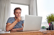 © marvent - Young man at his desk with a mug of coffee