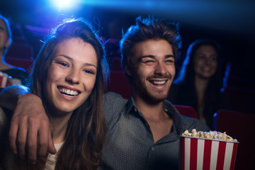 Wall Mural - Happy couple in the movie theater