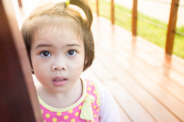 Closeup adorable face little asian girl.