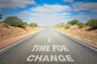 © alpegor - Time for Change: Conceptual image of a Desert Road with the Text on Asphalt