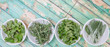 Basil leaves, rosemary. mint, parsley and sage leaves herbs in white bowl over wooden background