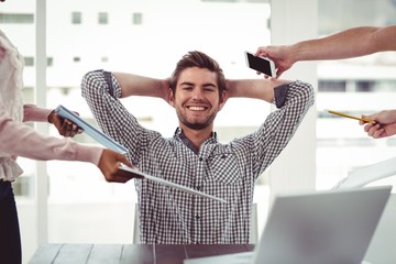 Wall Mural - Smiling businessman being handed items