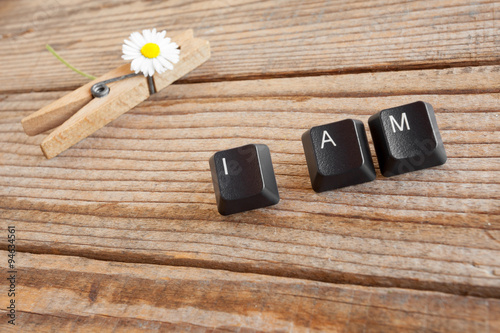 Fotografia, Obraz I AM wrote with keyboard keys on wooden background