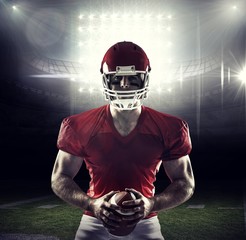 Canvas Print - Composite image of american football player holding ball