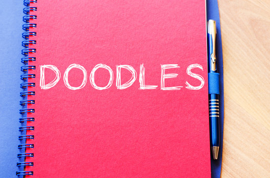 Doodles write on notebook