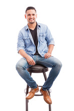 Good Looking Man Sitting In A Chair