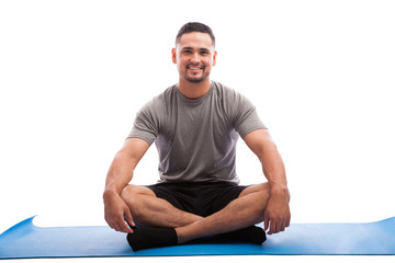 Wall Mural - Happy young man in yoga class