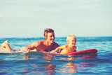 Fototapeta  - Father and Son Surfing