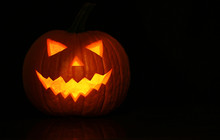 Halloween Glowing Pumpkin On Black Background
