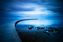 Blue Sea And Curve Jetty