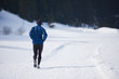 jogging on snow in forest