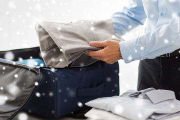 Sticker - businessman packing clothes into travel bag