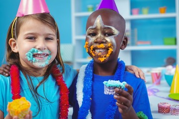 Wall Mural - Smiling kids with icing on their faces