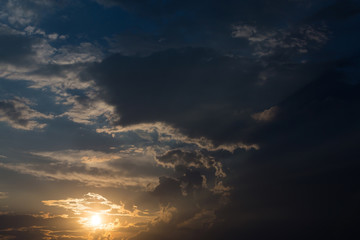 Wall Mural - colorful sunset sky background with clouds and sun light