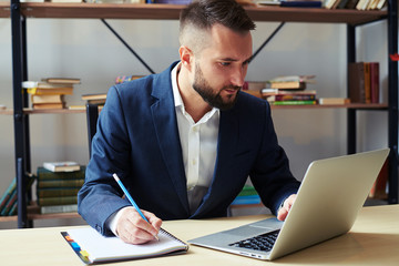 Wall Mural - man writing something in notepad