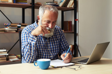 writer eating cookies and working in his room