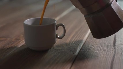 Wall Mural - pours hot coffee into a cup