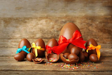 Wall Mural - Chocolate Easter eggs on wooden background