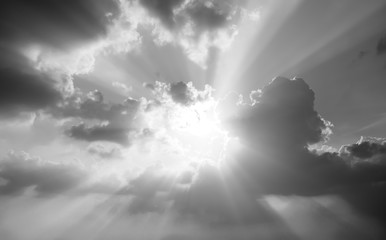 black and white dramatic landscape with cloudy sky at sunset