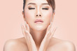 beautiful young asian woman with closed eyes touching her face, Beautiful Spa Perfect Fresh Skin, Youth and Skin Care Concept over pink background with clipping path. 