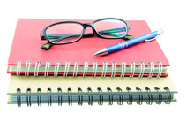 Blank Diary, Pen, And Glasses On White Background