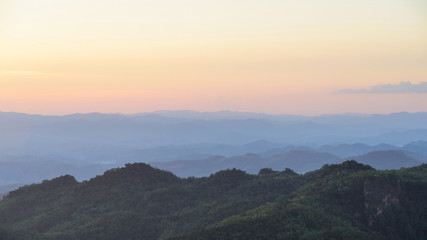Wall Mural - sunset sky and misty layer mountain in sri nan national park thailand