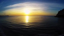 Sunset On The Calpe Beach - Tranquil Idyllic Scene Of A Golden Sunset Over The Sea. Costa Blanca, Spain. Mediterranean Sea.
