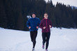 © .shock - couple jogging outside on snow