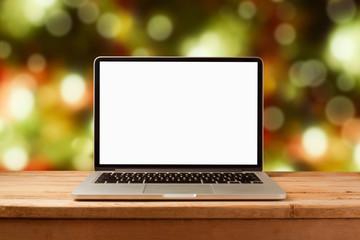 laptop computer mock up over christmas bokeh background