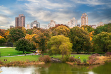 New York City Manhattan Central Park Panorama With Autumn Lake With Skyscrapers And Colorful Trees..