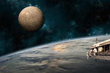 Wall Mural - a team of astronauts work on a space station - elements of this image furnished by nasa.