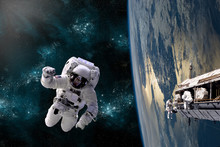 A Team Of Astronauts Perform Work On A Space Station - Elements Of This Image Furnished By NASA.